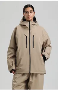 Detail of waterproof zippers and windproof cuffs on a beige professional ski jacket