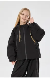 Detail of kids black hooded ski jacket with large vertical zipper pockets and velcro cuffs