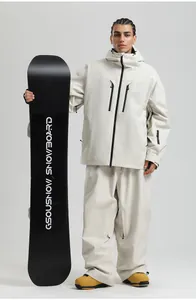 Full view of beige waterproof ski jacket and pants set with black contrast zippers