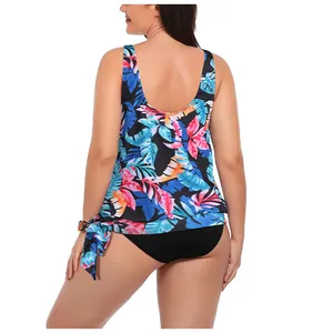 Detail of plus size tankini back view with tropical palm leaf print and waist tie