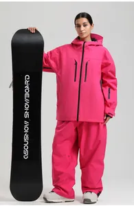 Detail of hot pink professional women's ski suit with waterproof zippers and hand guards