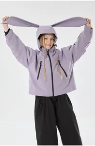 Kids lavender ski suit detail featuring rabbit ear hood and windproof fabric close-up