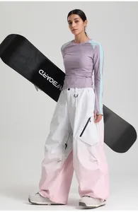 Detail of pink and white two-tone waterproof ski pants with D-ring and zipper pocket
