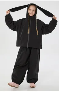 Detail of children's waterproof ski suit showing rabbit ear hood and windproof fabric