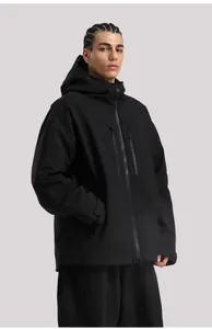 Detail view of black waterproof ski jacket featuring side pockets and adjustable velcro cuffs