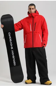 Detail of red windproof ski jacket and black pants featuring waterproof zippers and pockets