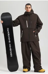 Detail of waterproof brown ski jacket and pants set with white zipper and professional hood