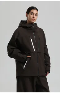 Detail of dark brown waterproof ski jacket with white zippers and functional pockets