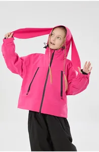 Detail of pink ski jacket featuring cute rabbit ear hood and windproof zipper pockets