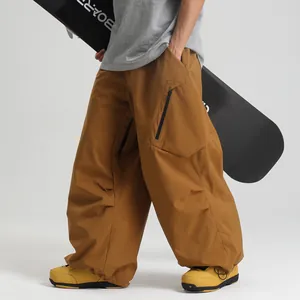 Brown waterproof ski pants for men and women featuring multi-pockets and loose cargo fit