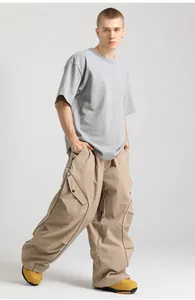 Detail of waterproof ski pants featuring cargo pockets and stylish contrast side stripes