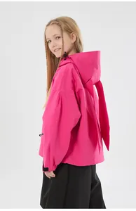 Detail of rose pink kids ski jacket featuring cute long bunny ears on the hood