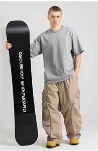 Loose fit khaki cargo snowboard pants featuring reflective details and a wide-leg cut