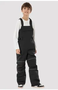 Detailed view of kids' black ski bib pants with adjustable straps and reflective stripes