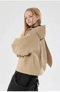 Detailed view of the cute rabbit ear design on the back of a khaki kid ski jacket