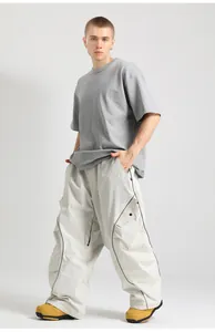 Detail of loose-fitting cargo pants with functional side pockets and black contrast piping