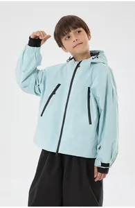 Detail of light blue waterproof ski jacket with adjustable windproof hood and zipper pockets