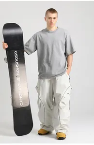 Detail of waterproof cargo ski pants with contrast piping and side utility pockets