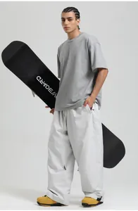Detail view of baggy snow pants with side zipper pockets and functional cargo style