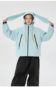 Detail of children's light blue ski jacket featuring cute bunny ears on the hood