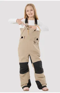 Close-up of kids waterproof ski bib pants with reinforced knees and reflective details