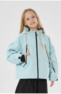 Detail of light blue kids ski jacket with waterproof fabric and adjustable cuffs