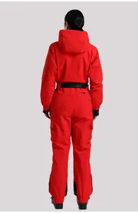 Rear view of red women's one-piece ski suit showing hood and branded black waist belt
