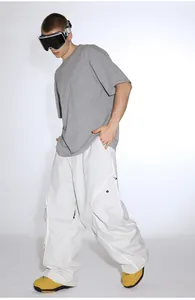 Detailed view of cargo ski pants with reflective strips and multi-pocket gorpcore design