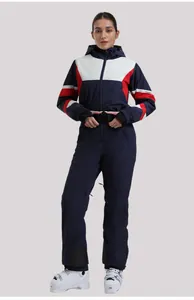Detail of navy blue women's ski jumpsuit with color block design and waist belt