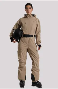 Detail of khaki one-piece ski suit featuring cargo pockets and adjustable waist belt