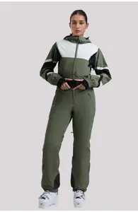 Front view of women's one-piece ski suit in green and white with waist belt and hood