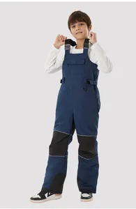 Kids ski bib with adjustable straps, reinforced knees, and reflective safety details