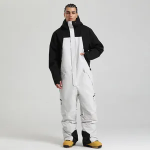 Combinaison de ski imperméable noir et blanc pour homme avec capuche et poches cargo