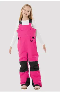 Close-up of pink children's ski bib with black reinforced knee pads and adjustable straps