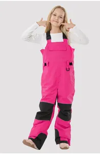 Detail of kids pink ski bib with adjustable straps and reinforced black knee patches
