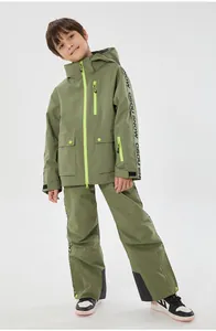 Detail of kids olive green ski suit set with waterproof fabric and neon green accents