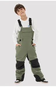 Detail of kids ski bib pants featuring adjustable straps and black reinforced knee patches