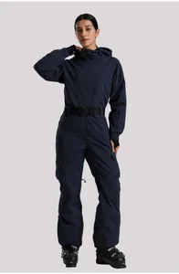 Detail of navy one-piece ski suit with adjustable buckle belt and waterproof pockets