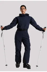Detail of dark blue women's one-piece ski suit with functional waterproof zippers and belt