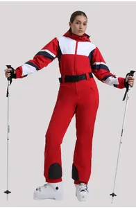 Detail of slim fit one-piece ski suit with windproof hood and adjustable black waist belt