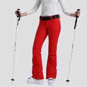 Pantaloni da sci rossi donna vestibilità slim impermeabili con cintura neve
