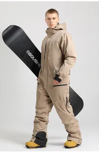 Detail of khaki one-piece men's ski suit showing waterproof fabric and utility pockets