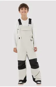 Close-up of kids waterproof ski overalls with adjustable black straps and pocket detail