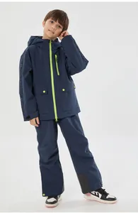 Detail of kids ski suit with waterproof fabric and adjustable velcro cuffs in navy blue