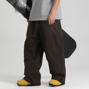 Waterproof dark brown baggy snowboard pants with adjustable drawstring for winter skiing