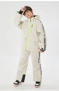 Detail of children's waterproof ski suit with fluorescent green zippers and side stripes