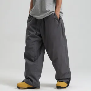 Loose fit dark grey waterproof ski pants with drawstring waist and cargo pockets