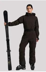 Detail of waterproof brown one-piece ski suit for women with black belt and cargo pockets
