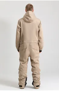 Rear view of khaki one-piece ski suit featuring hood and reinforced leg cuffs