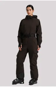 Detail of dark brown waterproof ski jumpsuit with GS SNOW belt and functional pockets